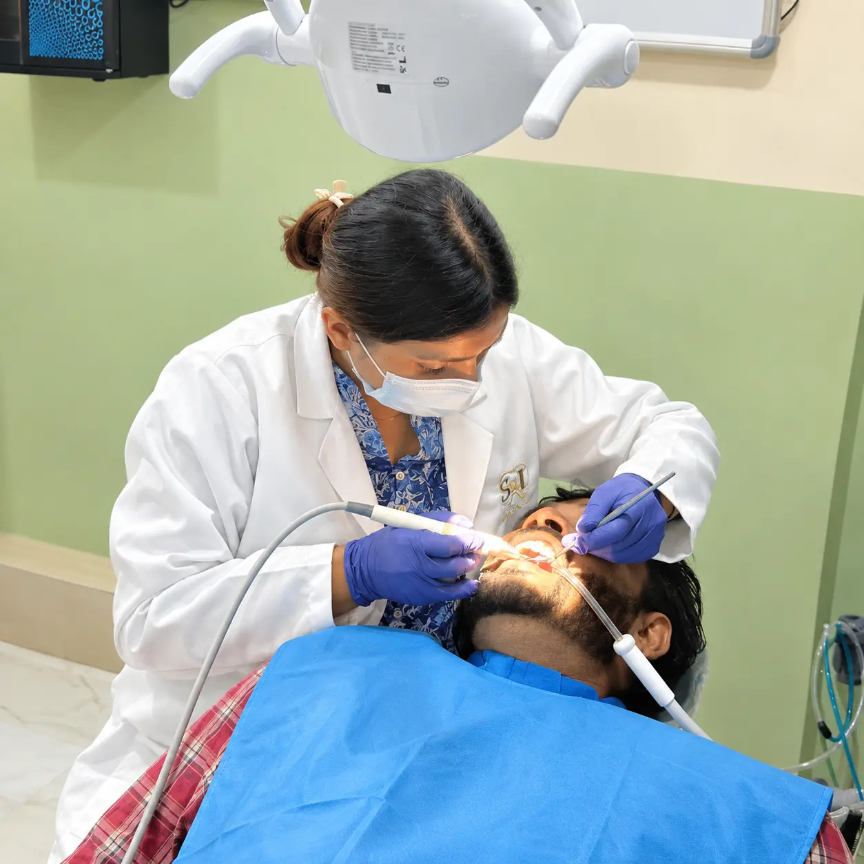scaling and polishing treatment is going on at S & I Dental Clinic